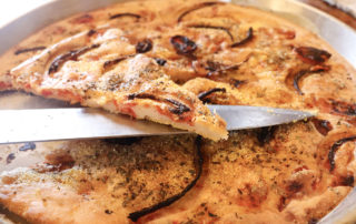 crunchy focaccia with cherry tomatoes and onions